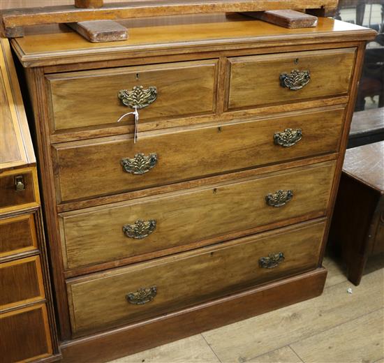 An Edwardian walnut chest of five drawers W.107cm